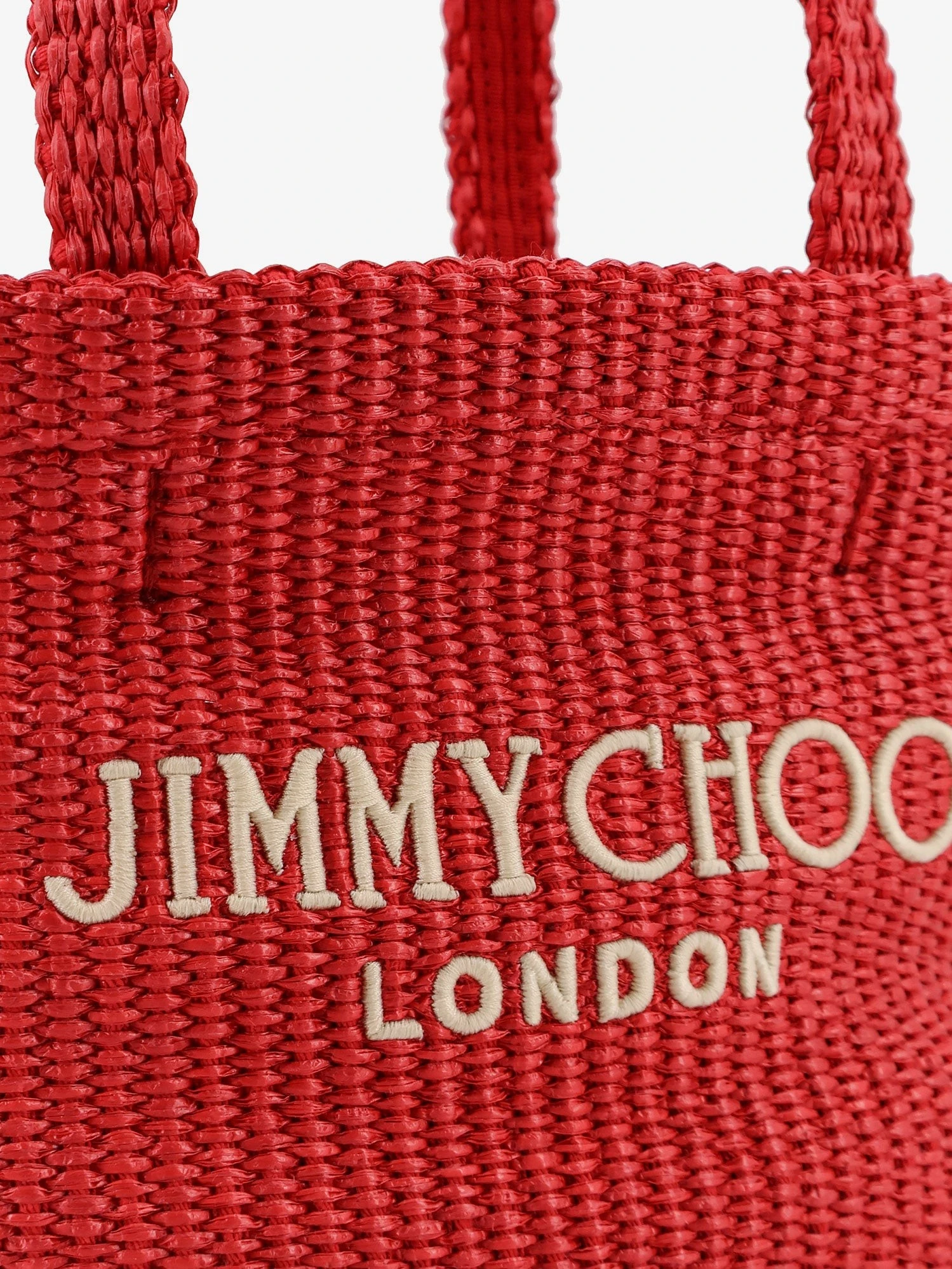 Raffia crossbody bag with embroidered logo on the front.webp