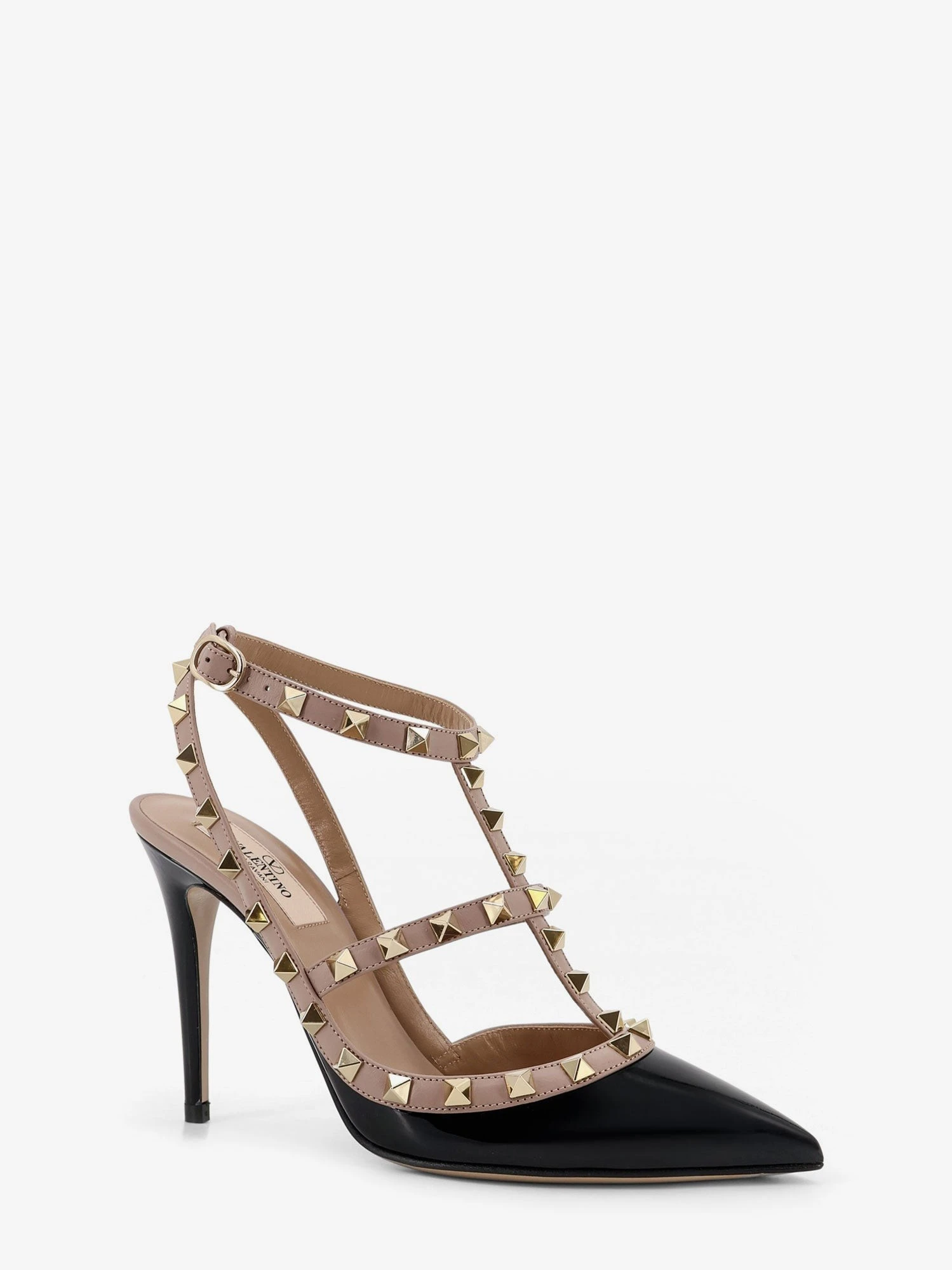 Rockstud patent leather pumps with iconic studs.webp