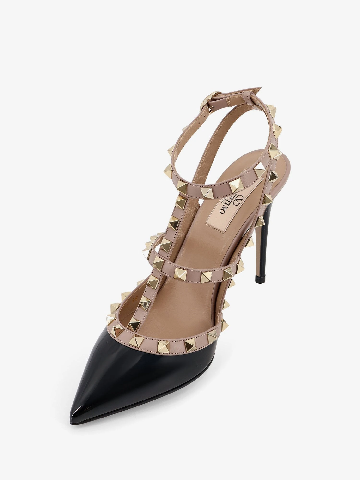 Rockstud patent leather pumps with iconic studs.webp