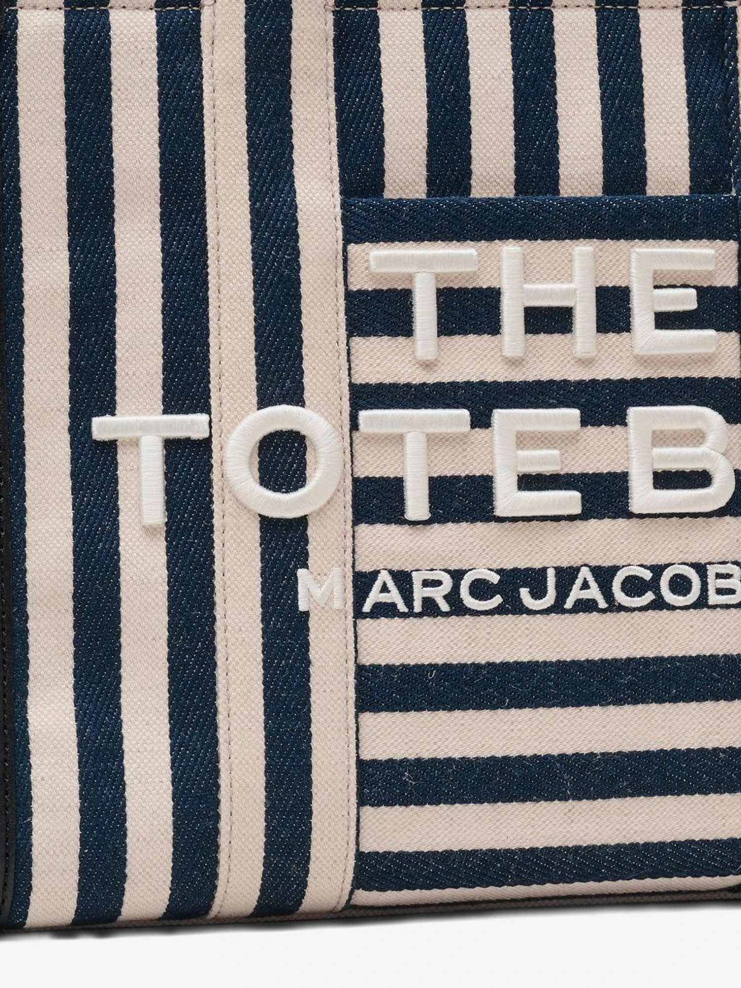 The Tote bag canvas handbag with embroidered logo on the front.webp