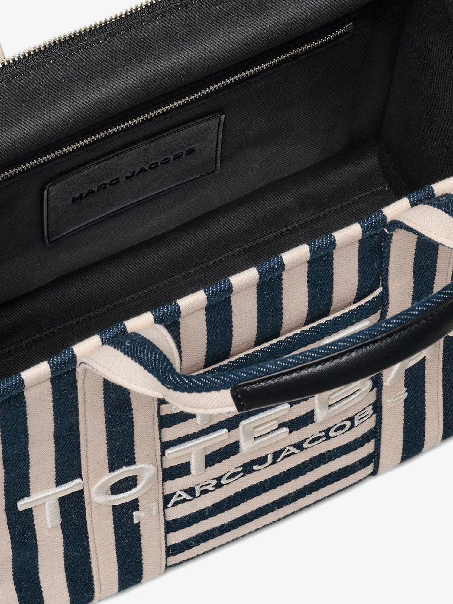 The Tote bag canvas handbag with embroidered logo on the front.webp