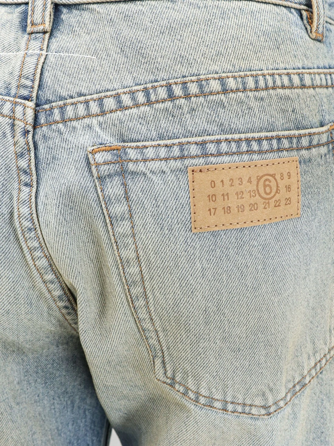 Jeans with Numeric Signature tag.webp