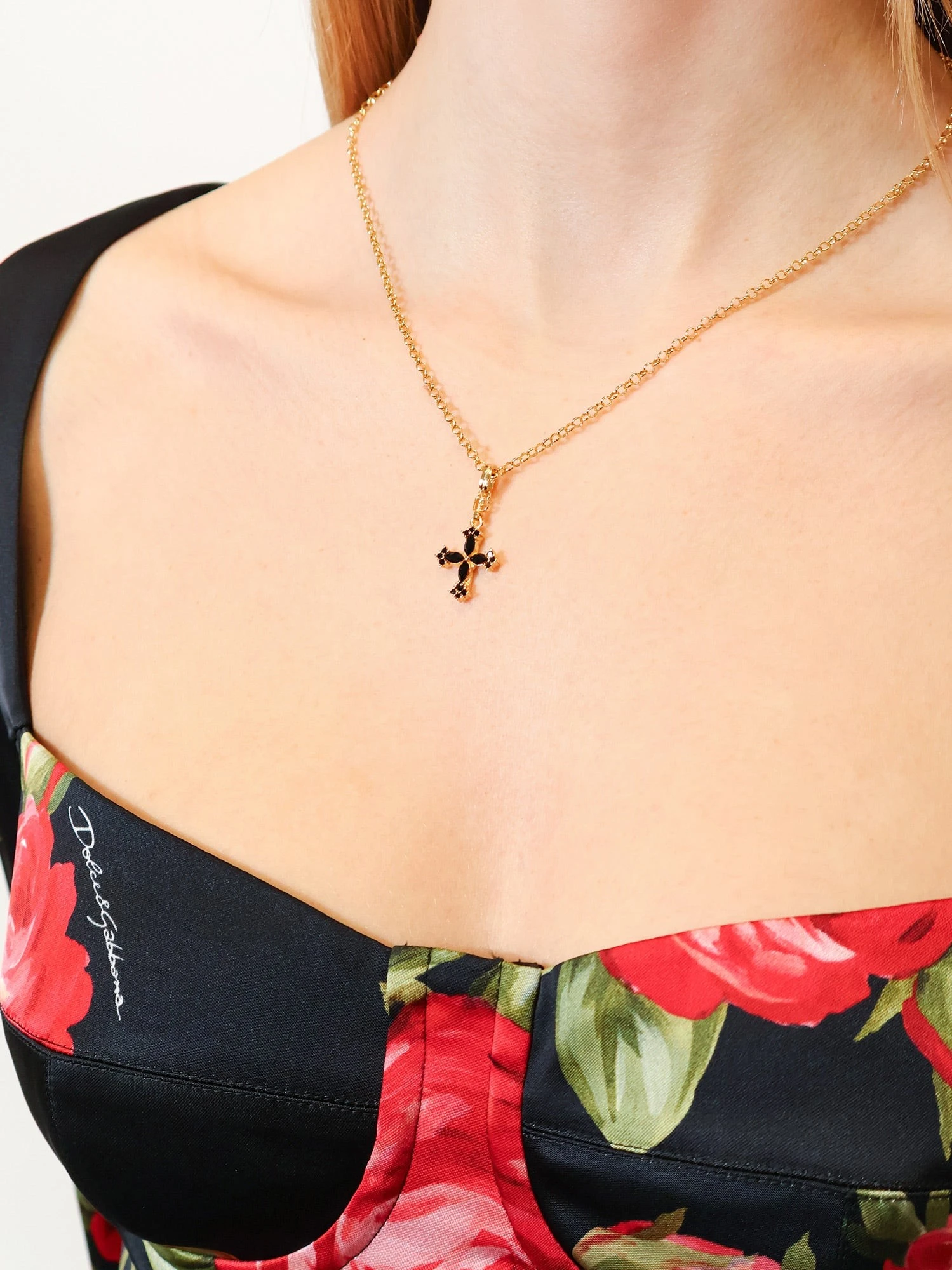 Metal necklace with rhinestone detail.webp