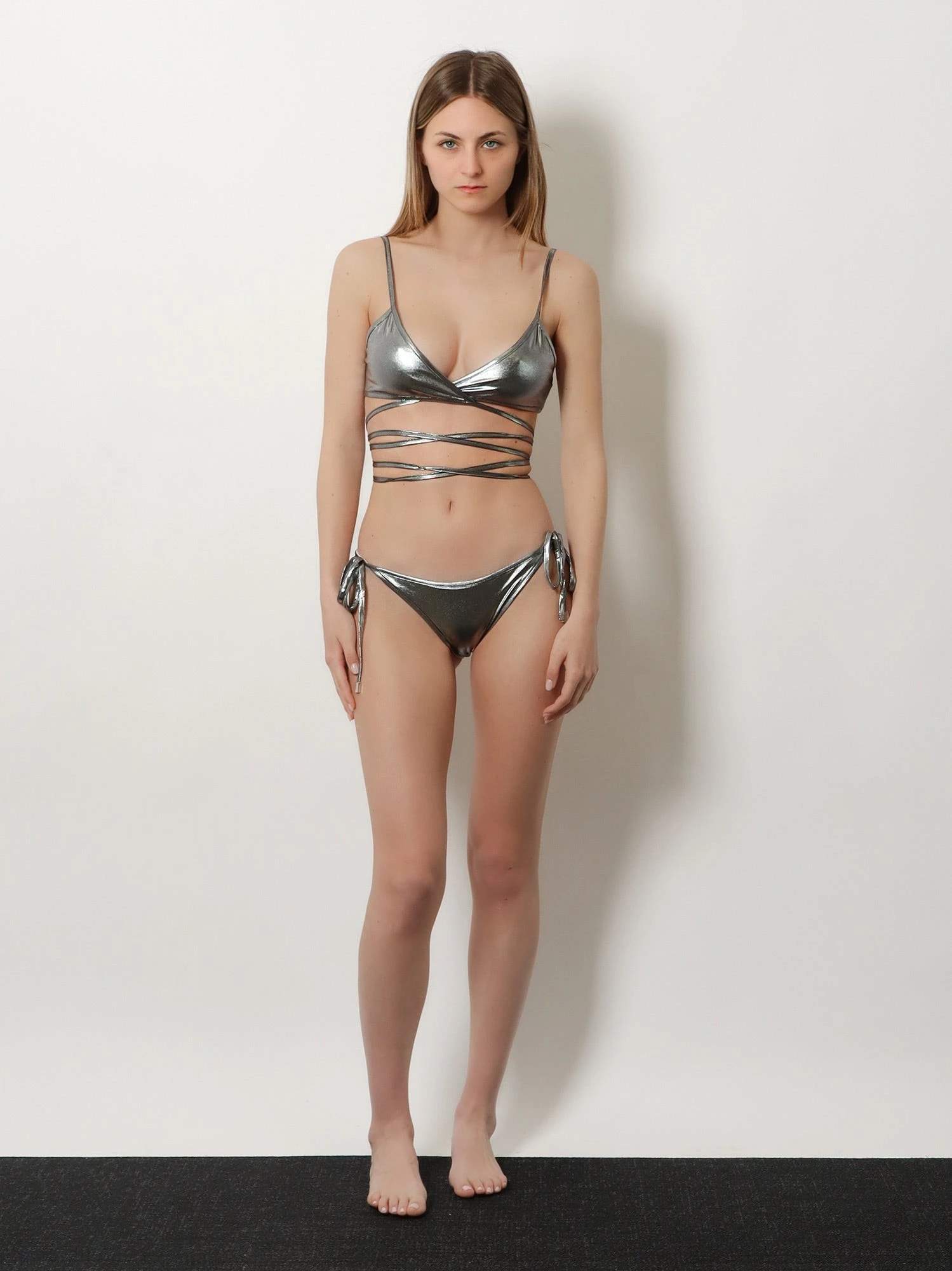 The Attico Il Primo Bagno lycra bikini with a metallic effect.webp