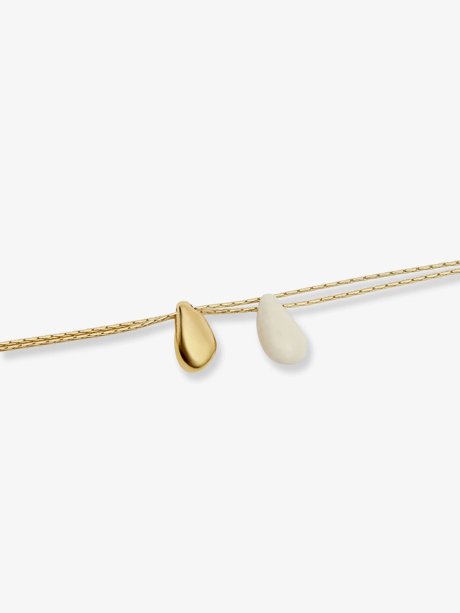 Brass necklace with gold finishes.webp