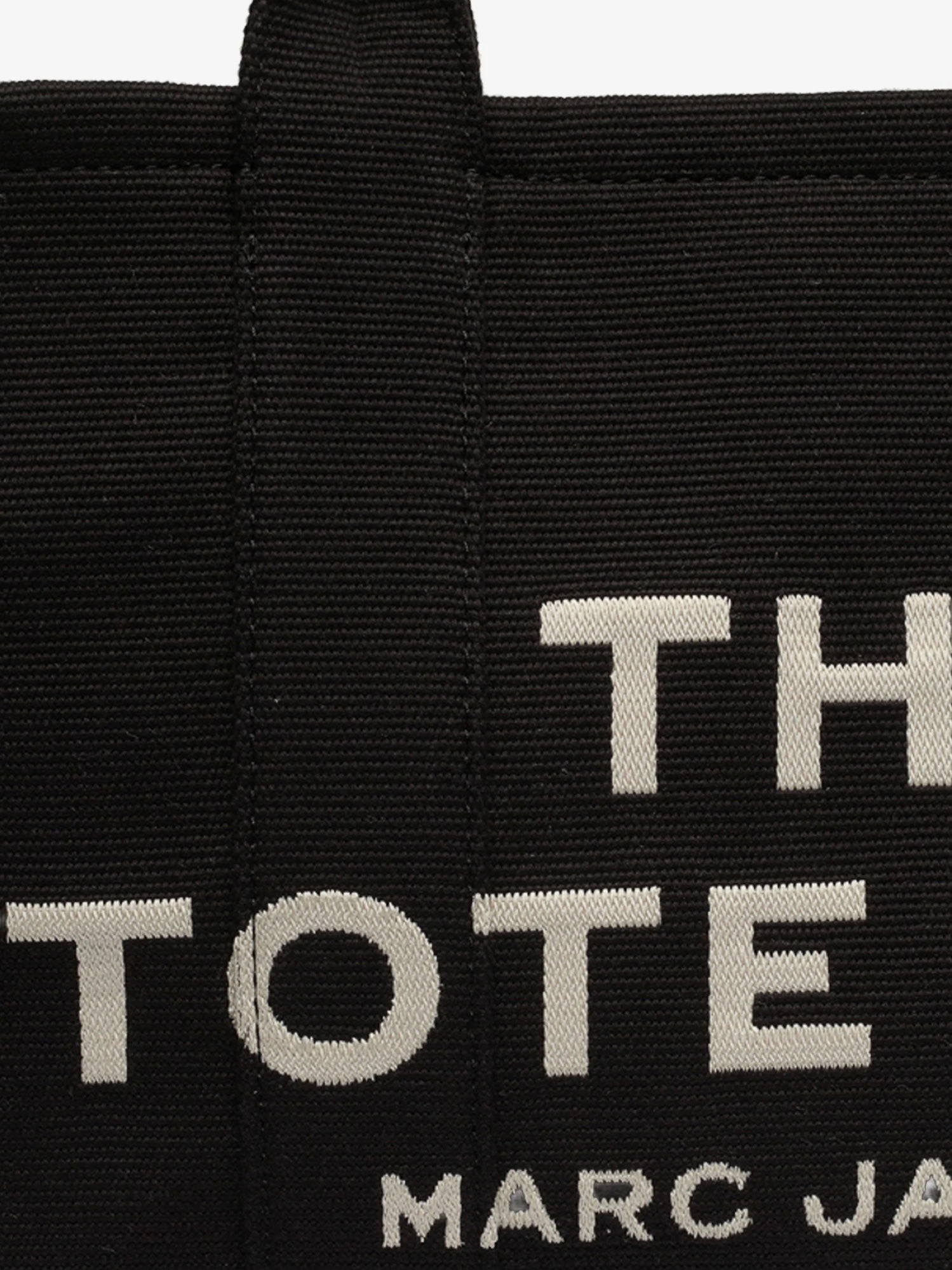 Traveler Tote canvas shopping bag with logo on the front.webp