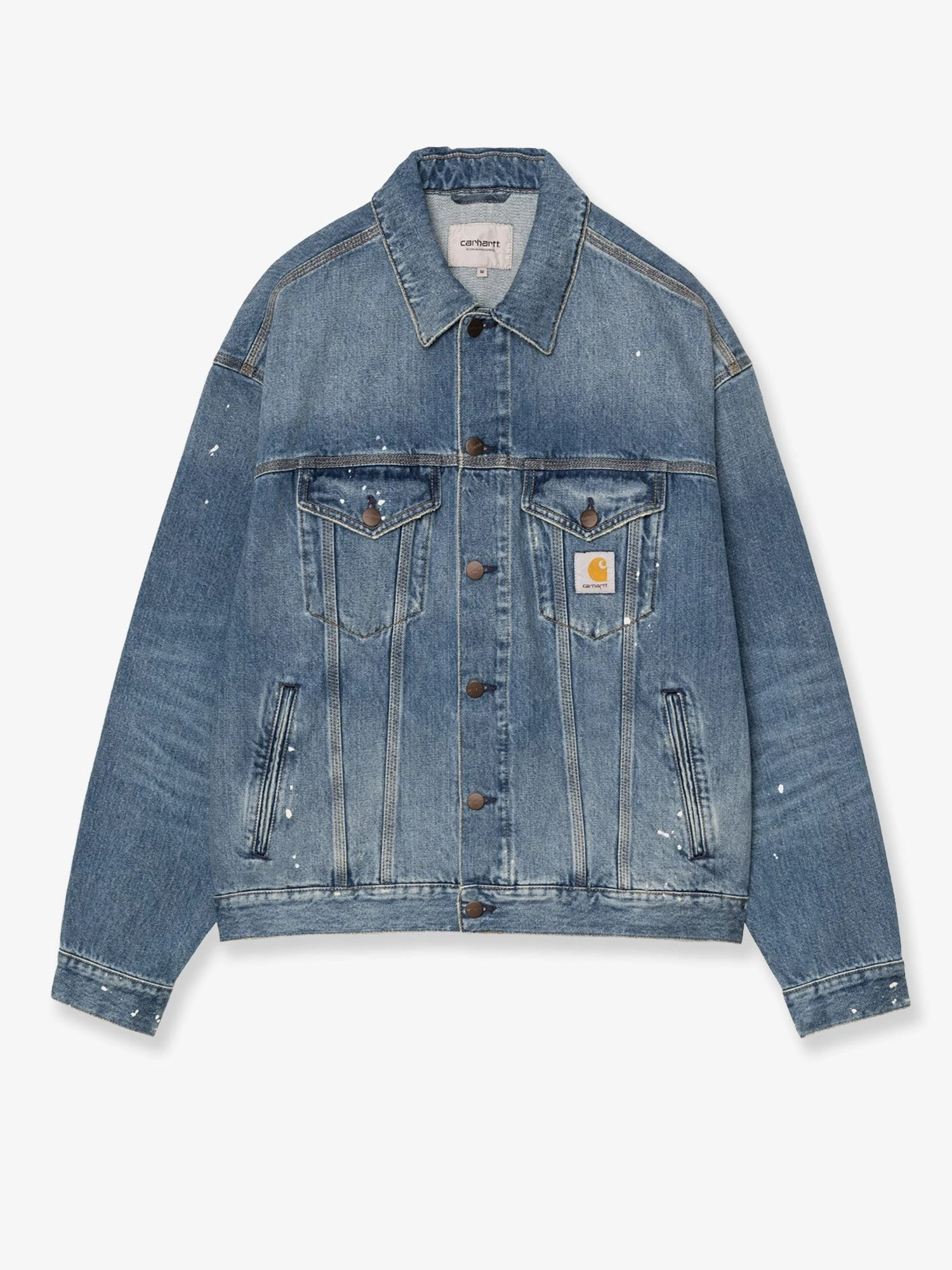 Blue denim jacket with distressed effect.webp