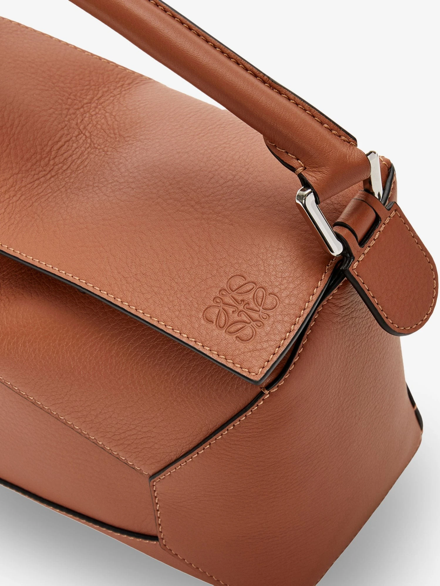 Puzzle Edge leather handbag with engraved Anagram logo.webp