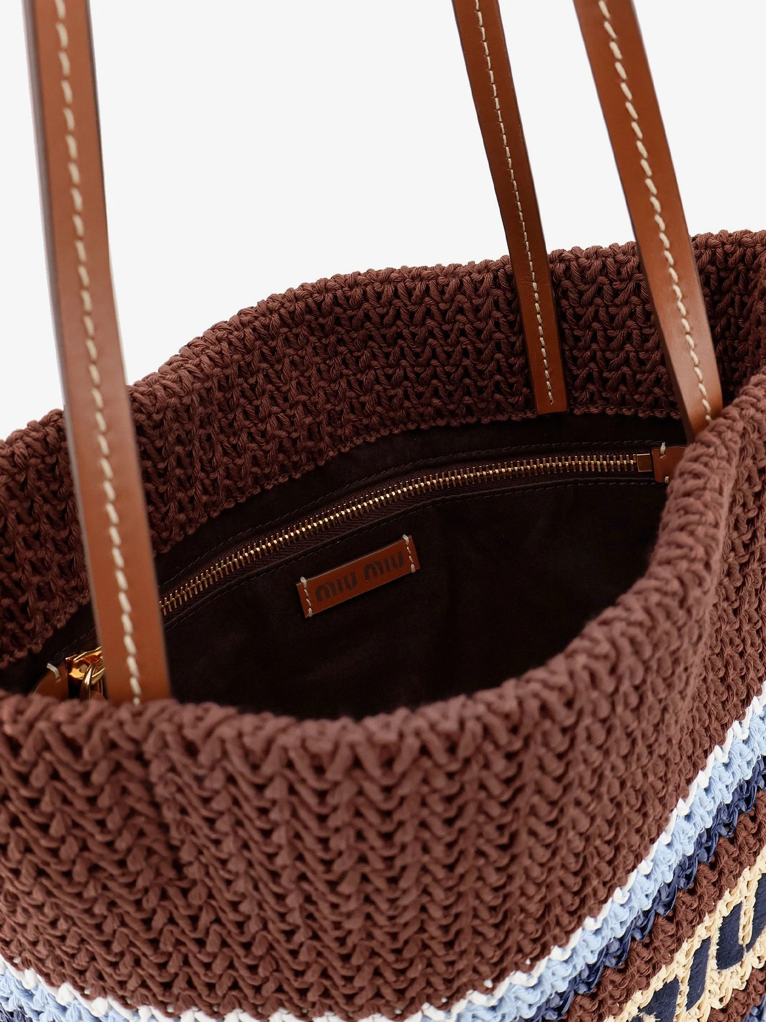 Knitted shopping bag with embroidered logo on the front.webp
