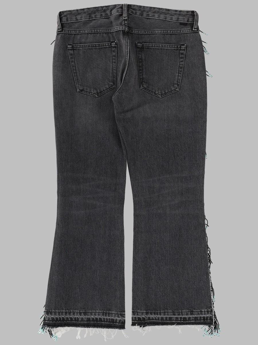 JEANS CON FRANGE DI PERLINE.webp