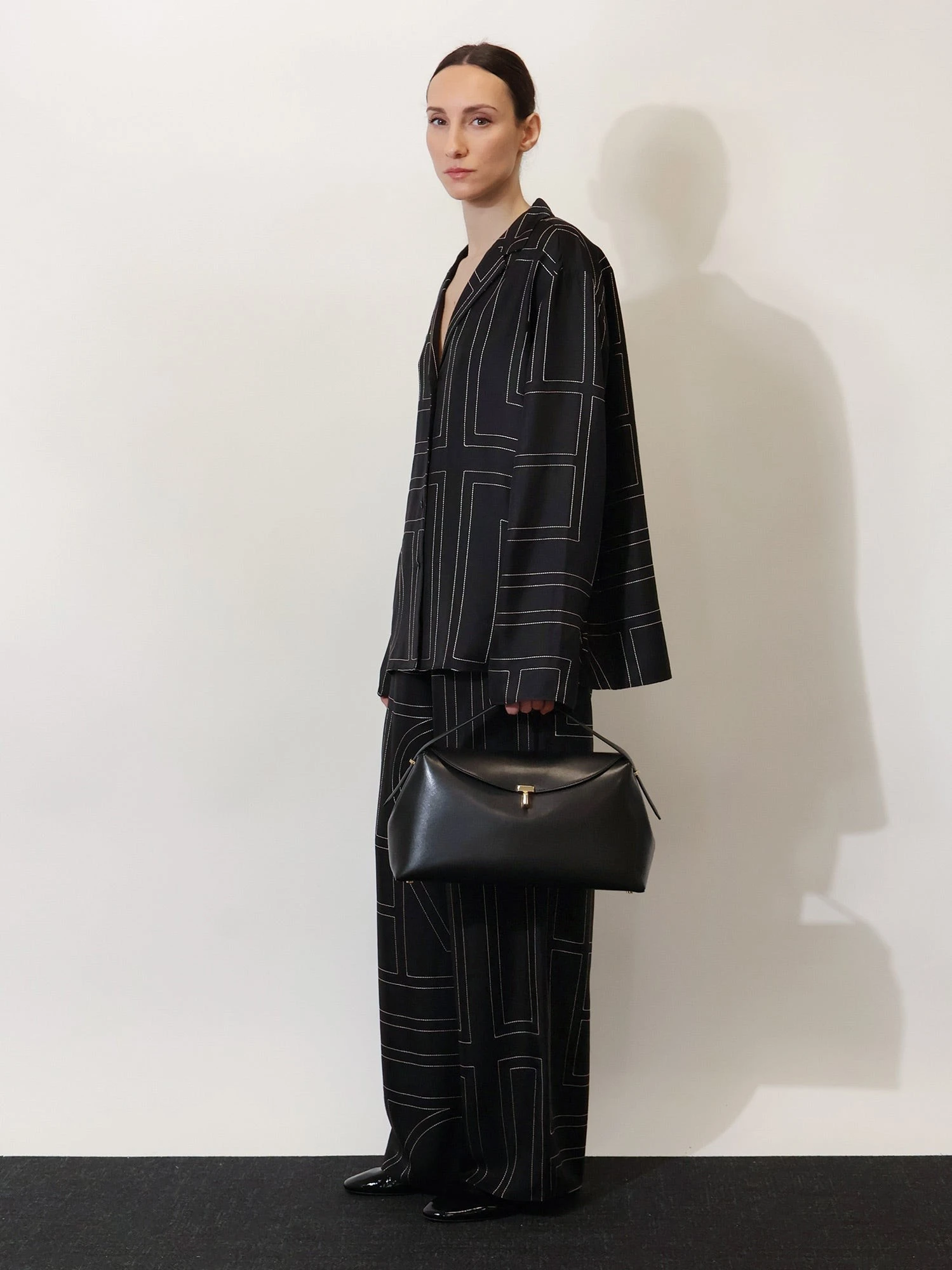 T-Lock leather crossbody bag.webp