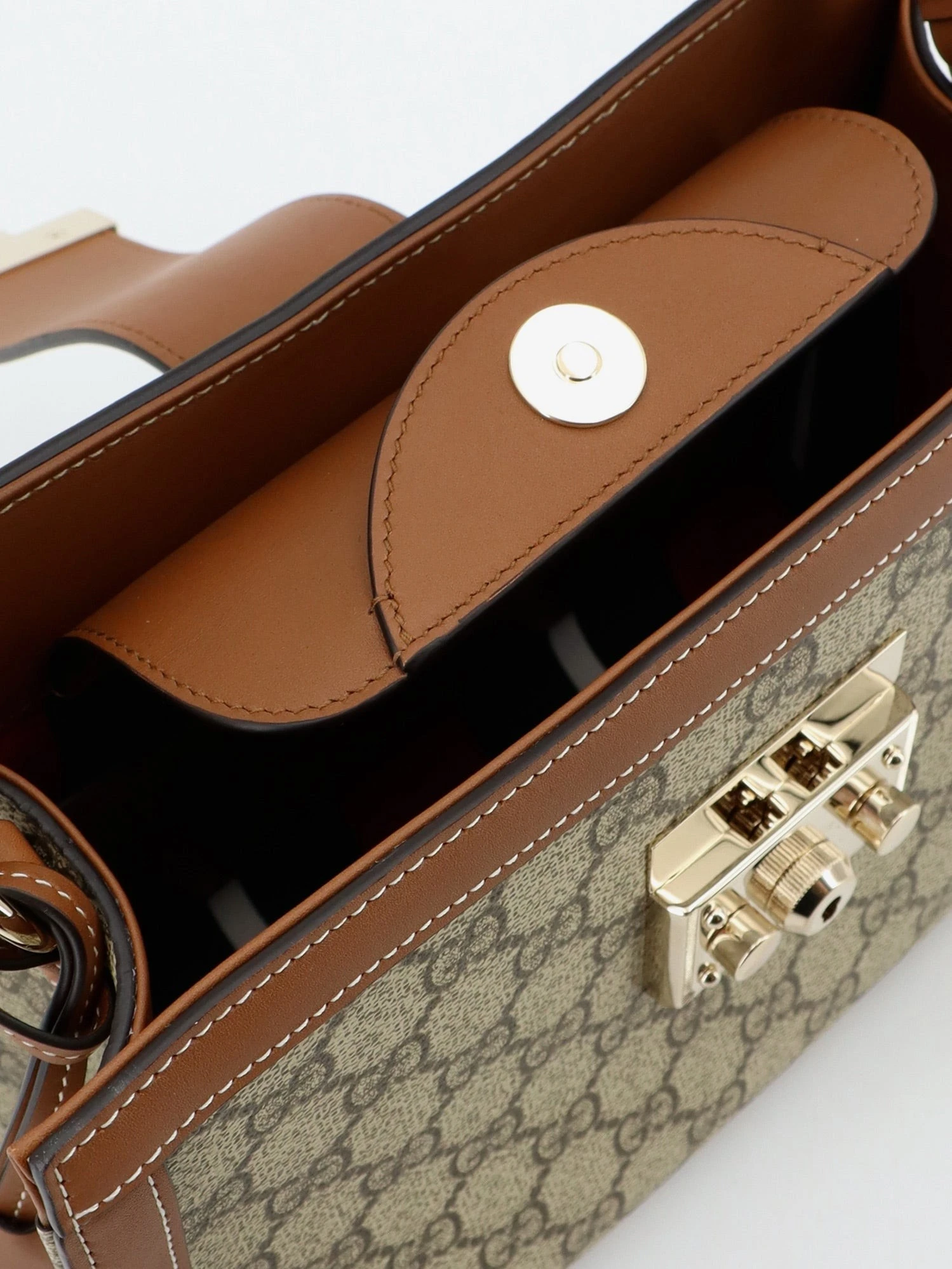 Padlock handbag with shoulder strap.webp