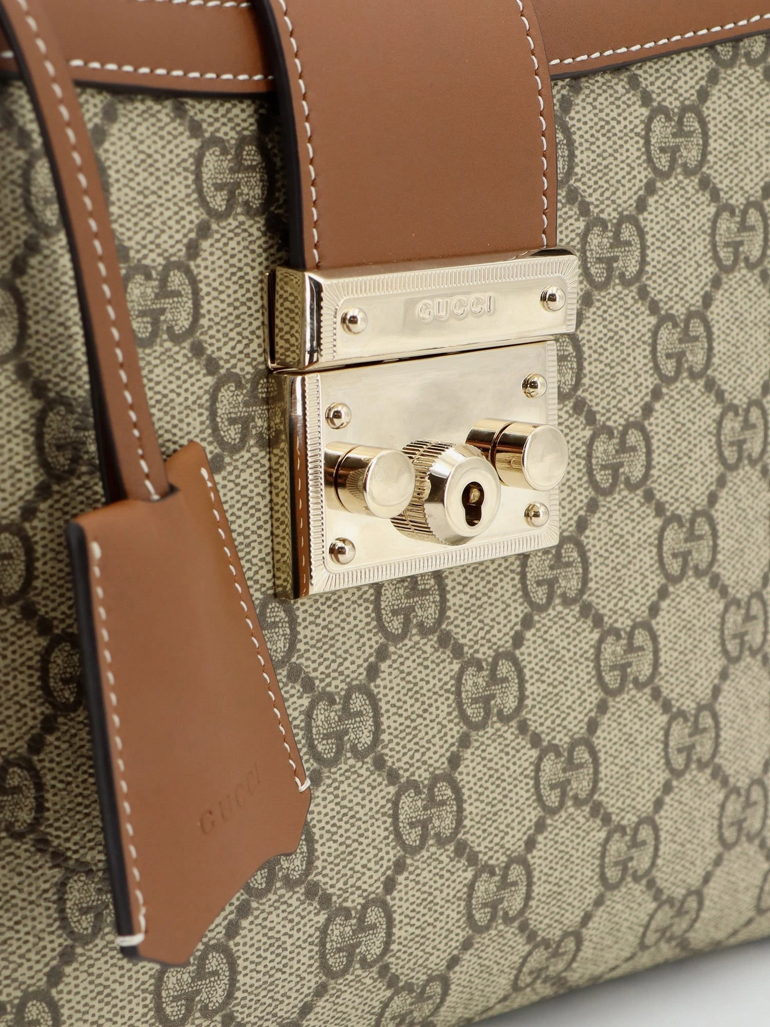 Padlock handbag with shoulder strap.webp