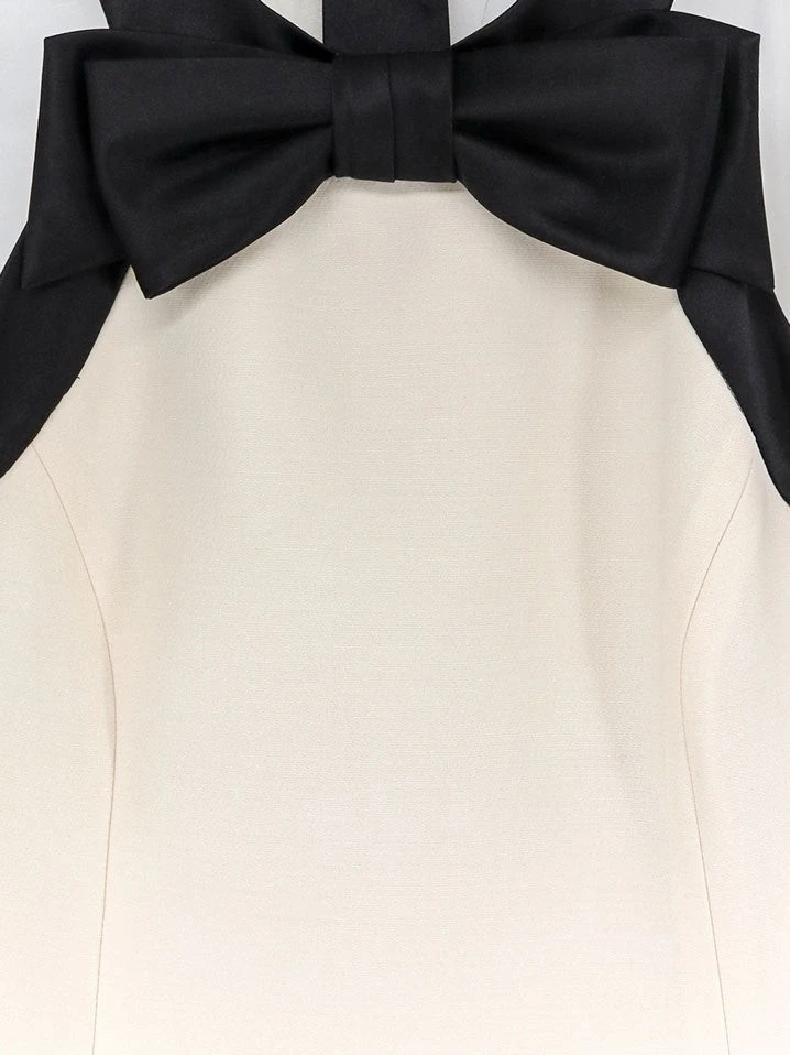Mini dress with bow detail.webp