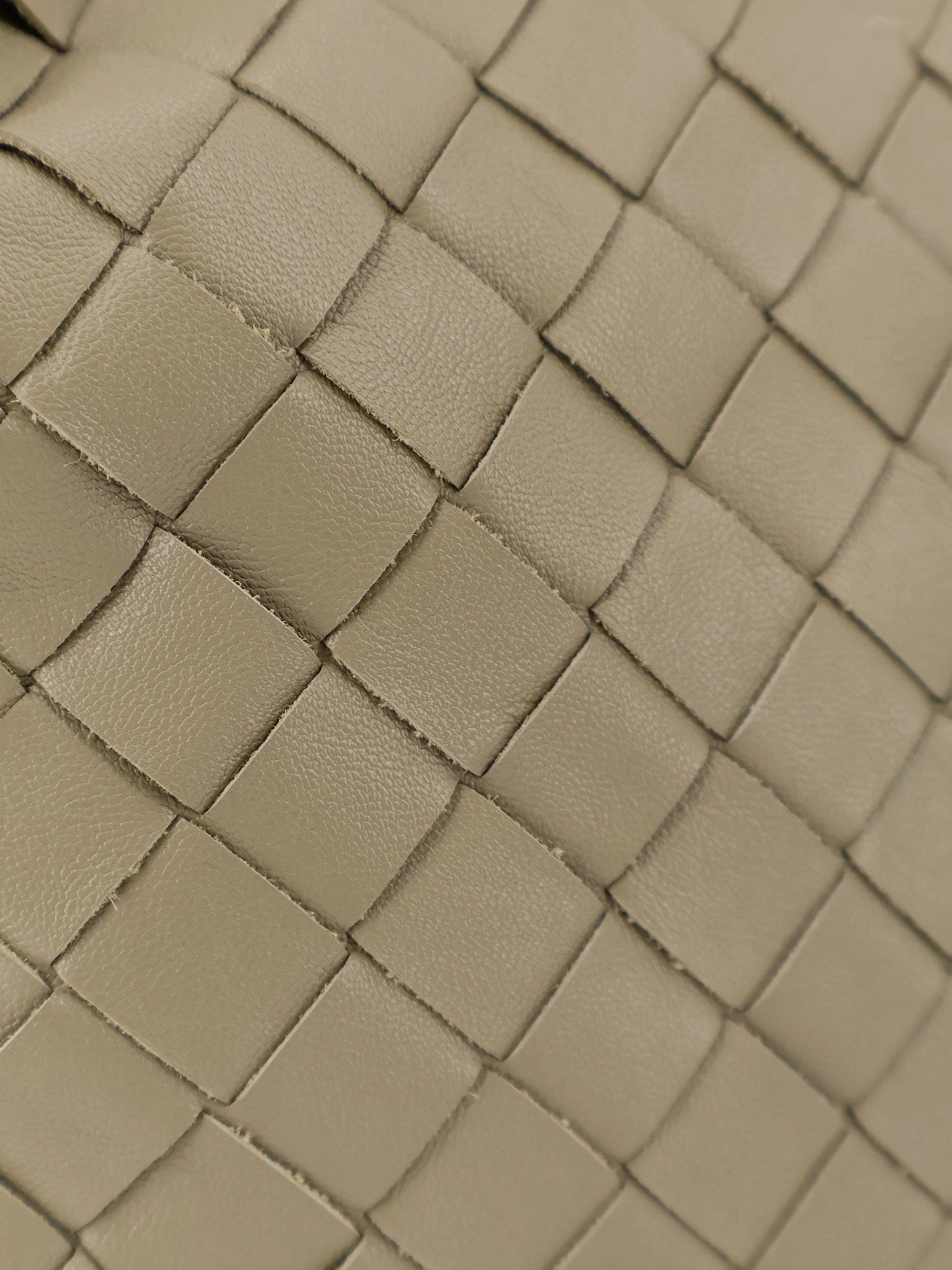 Mini Hop leather crossbody bag with Intrecciato pattern.webp