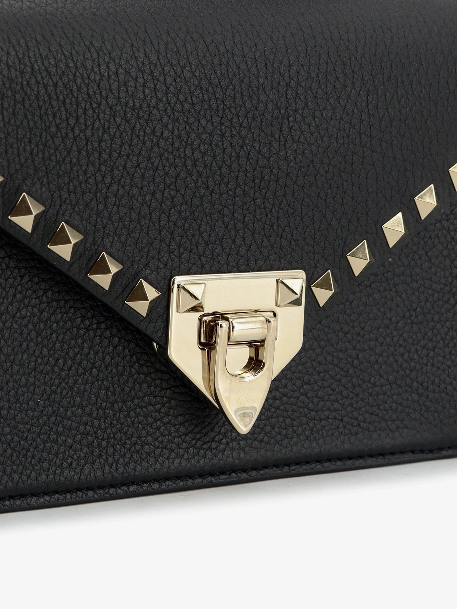 Rockstud leather crossbody bag with stud detail.webp