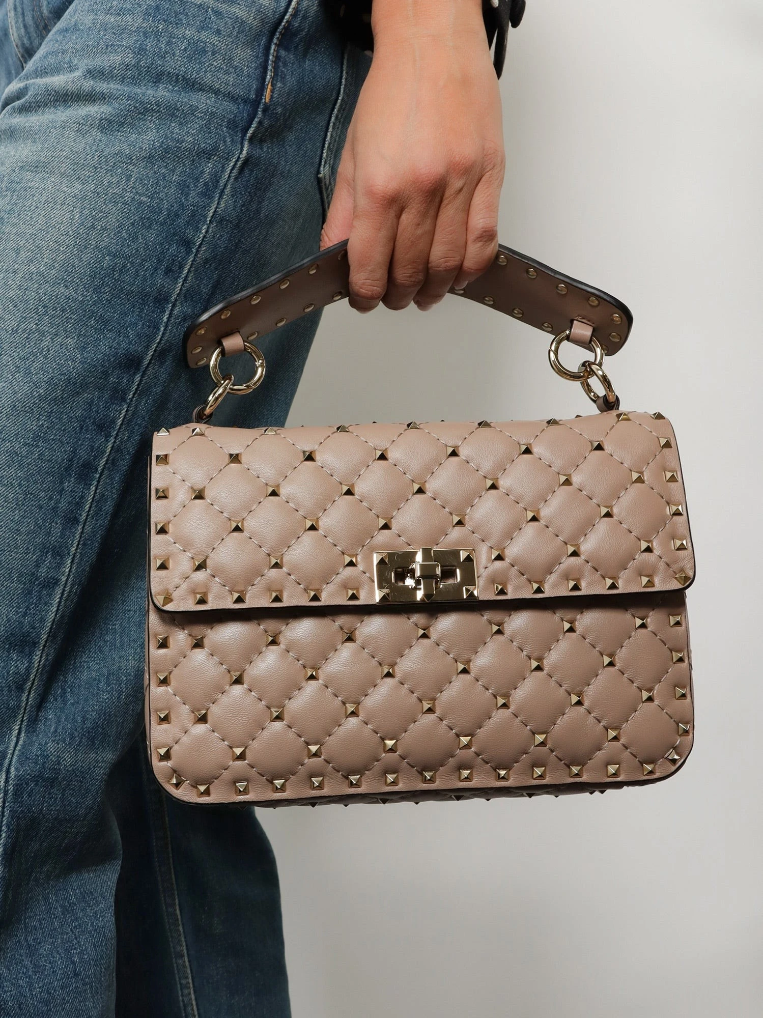 Rockstud Spike leather crossbody bag with iconic all-over studs.webp