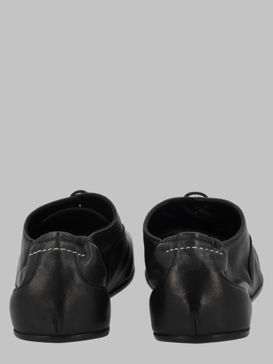 STRINGATA IN PELLE.webp