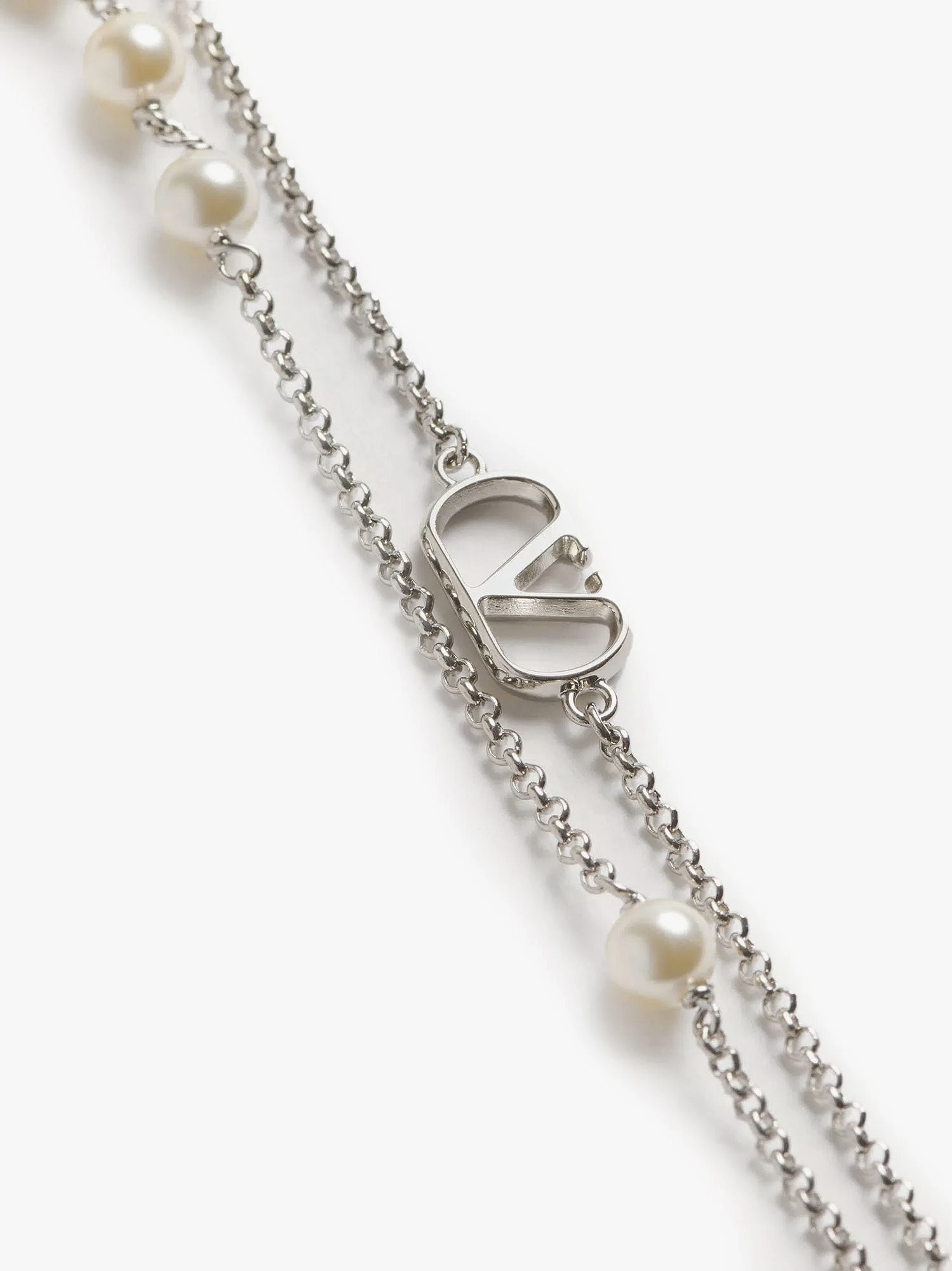 Metal necklace with silver finishes.webp