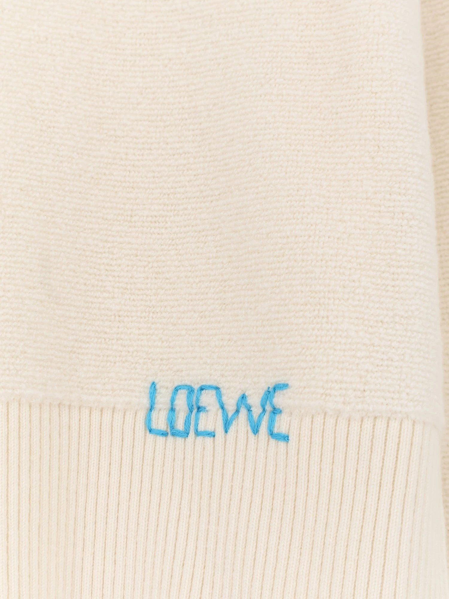 Wool sweater with contrasting embroidered logo on the bottom.webp