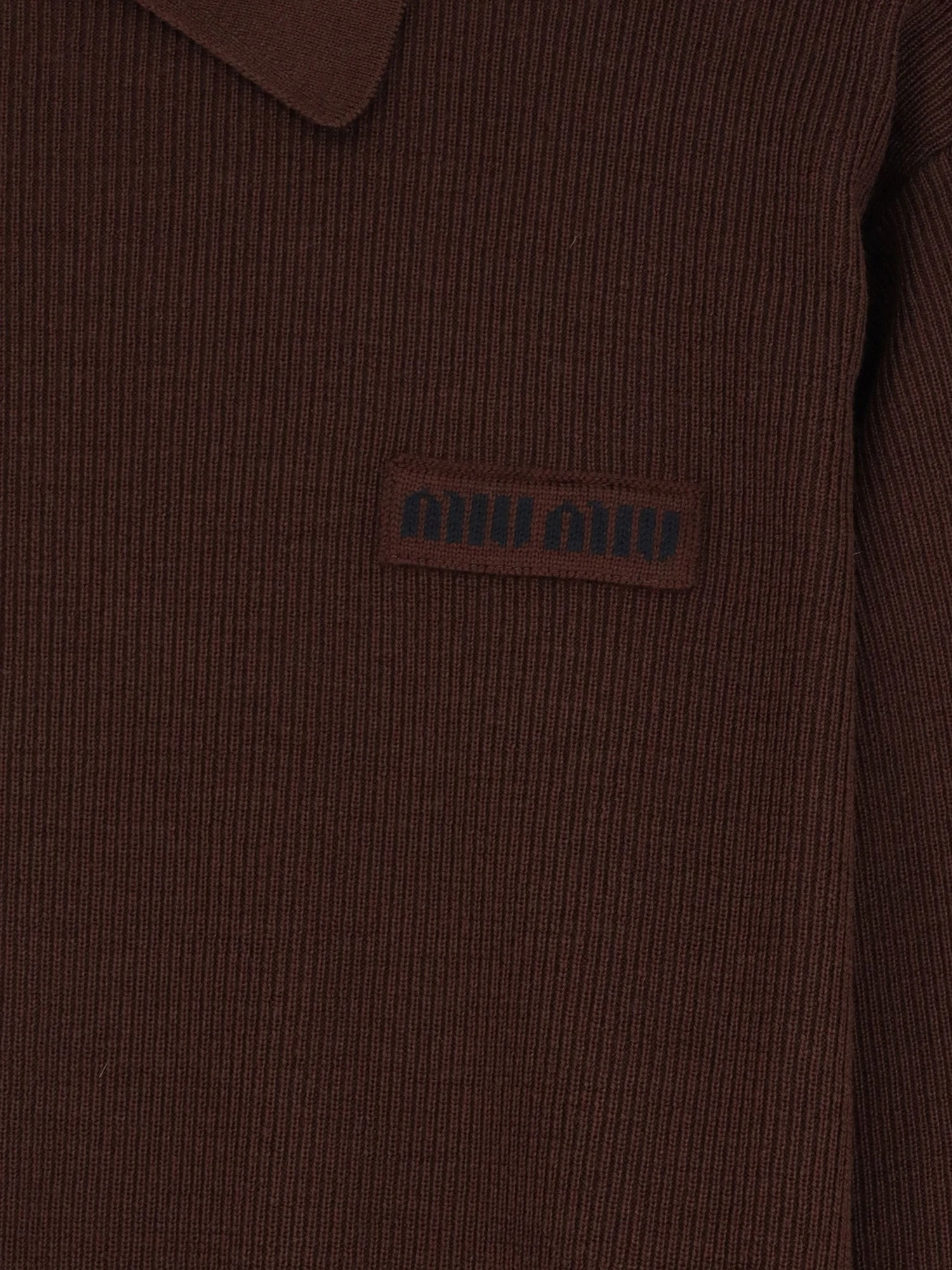 Wool polo shirt with embroidered logo on the front.webp