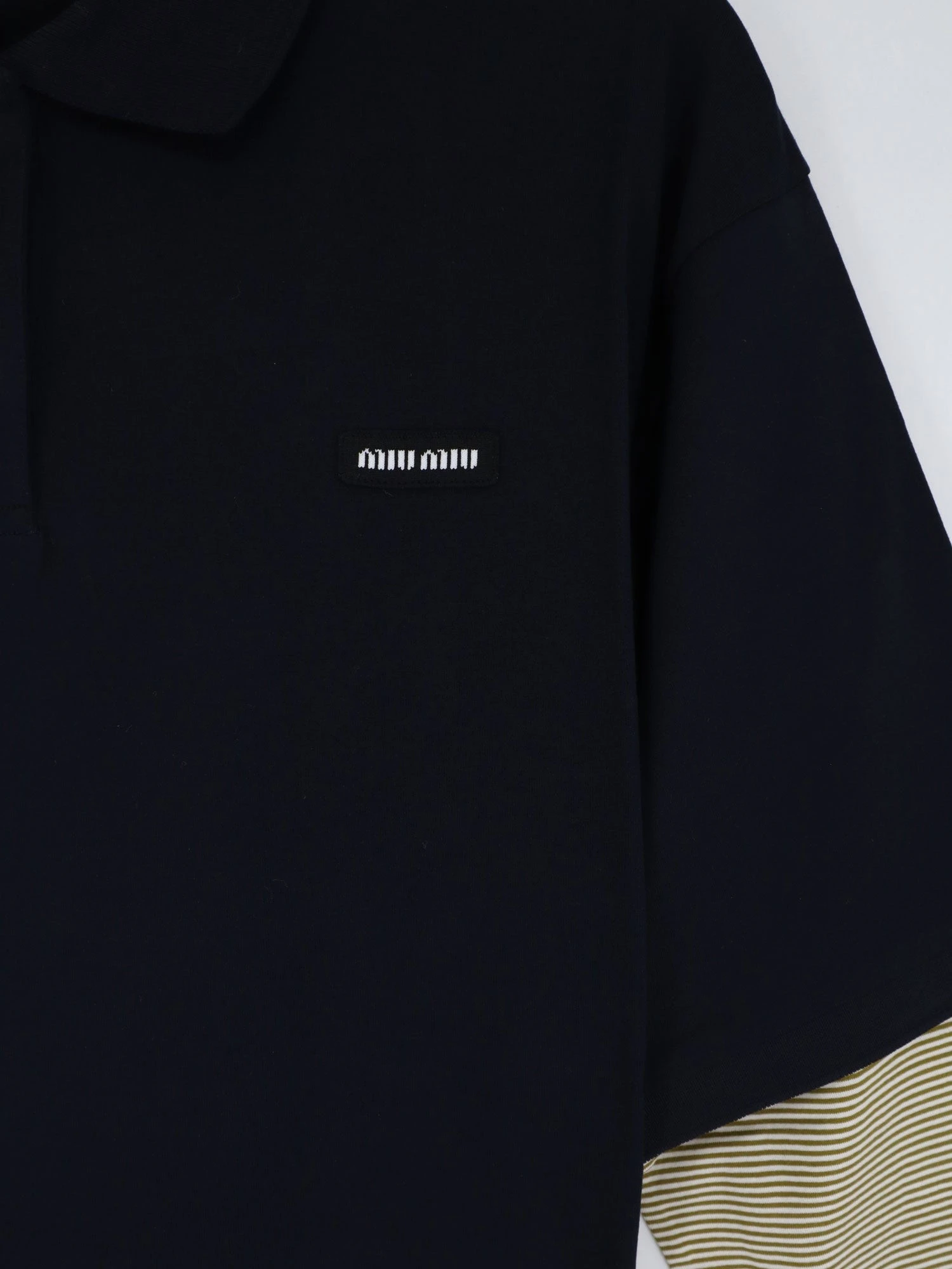 Cotton polo shirt with front embroidered logo.webp