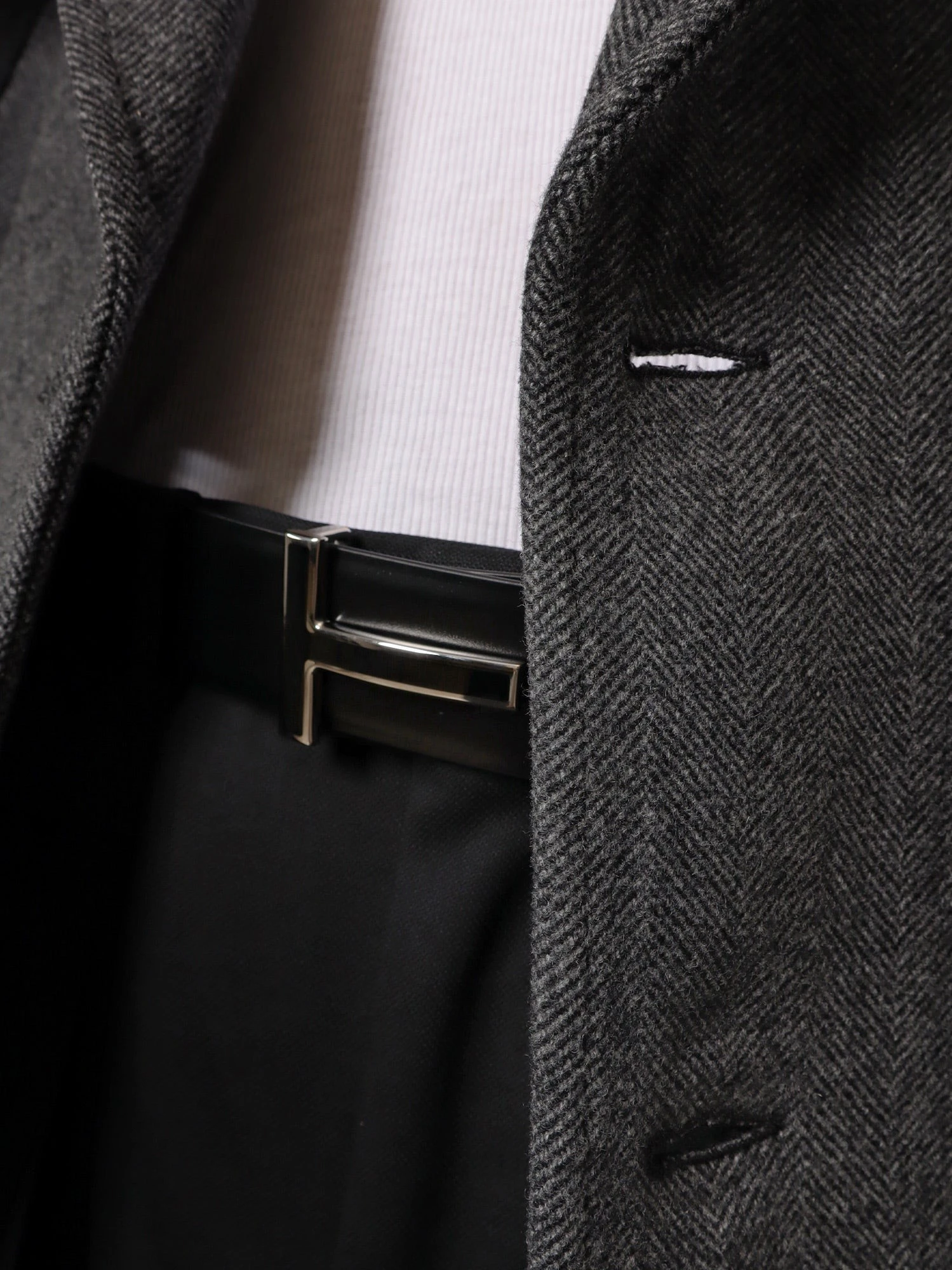 Leather belt with enameled logo.webp