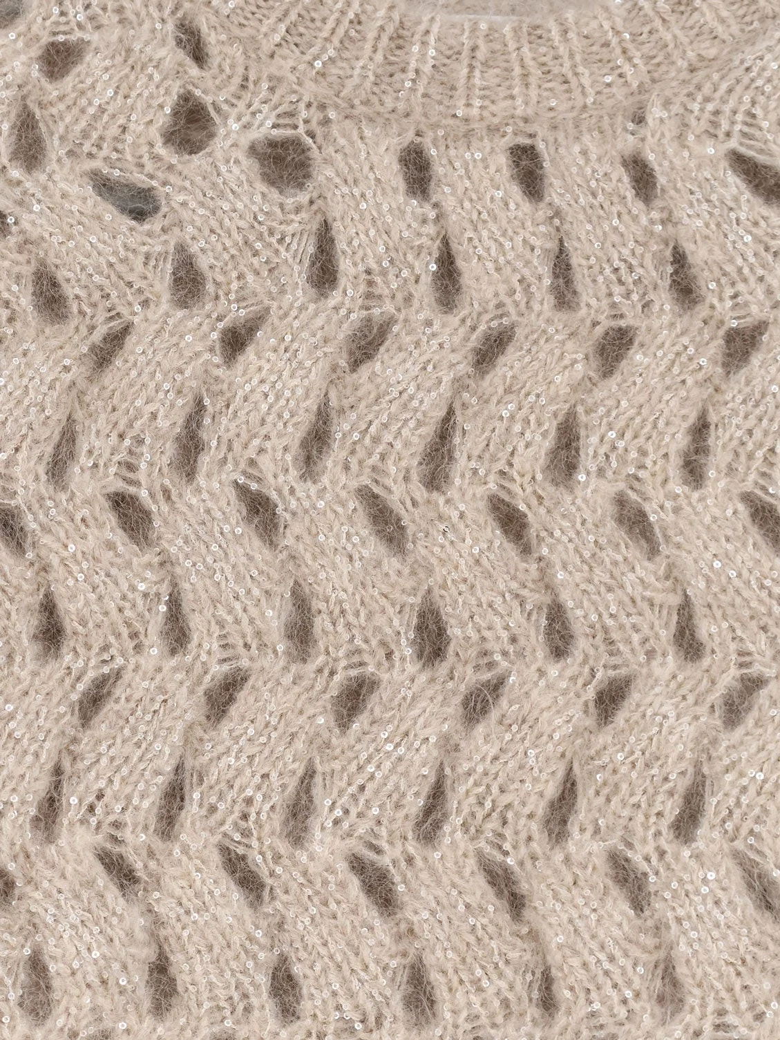 Perforated sweater with micro sequins