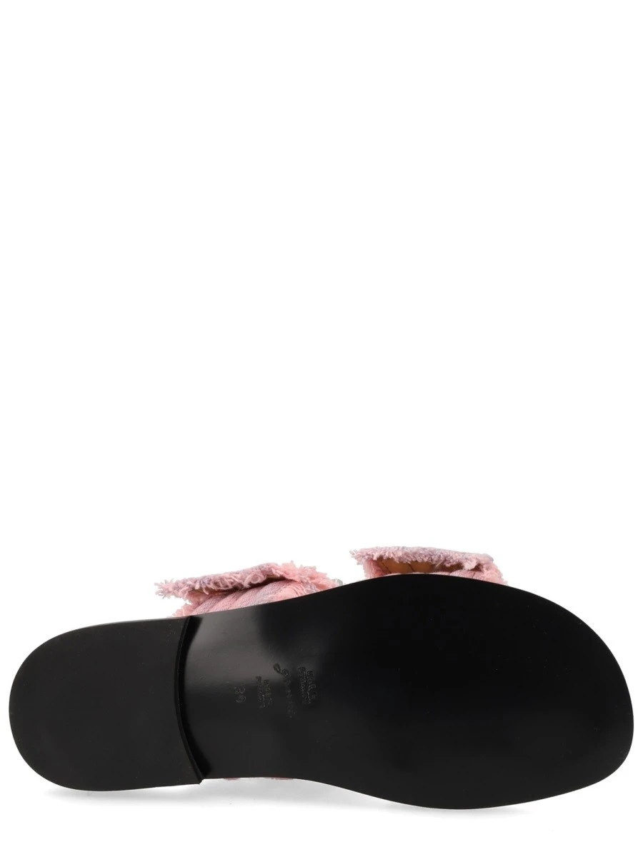 Leather sneakers with stitching detail.webp