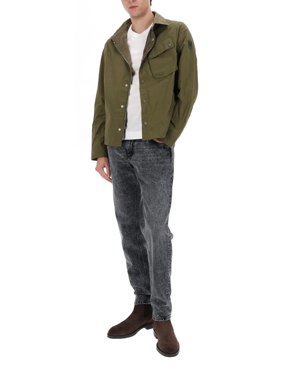 Highlands coated canvas backpack with front logo.webp