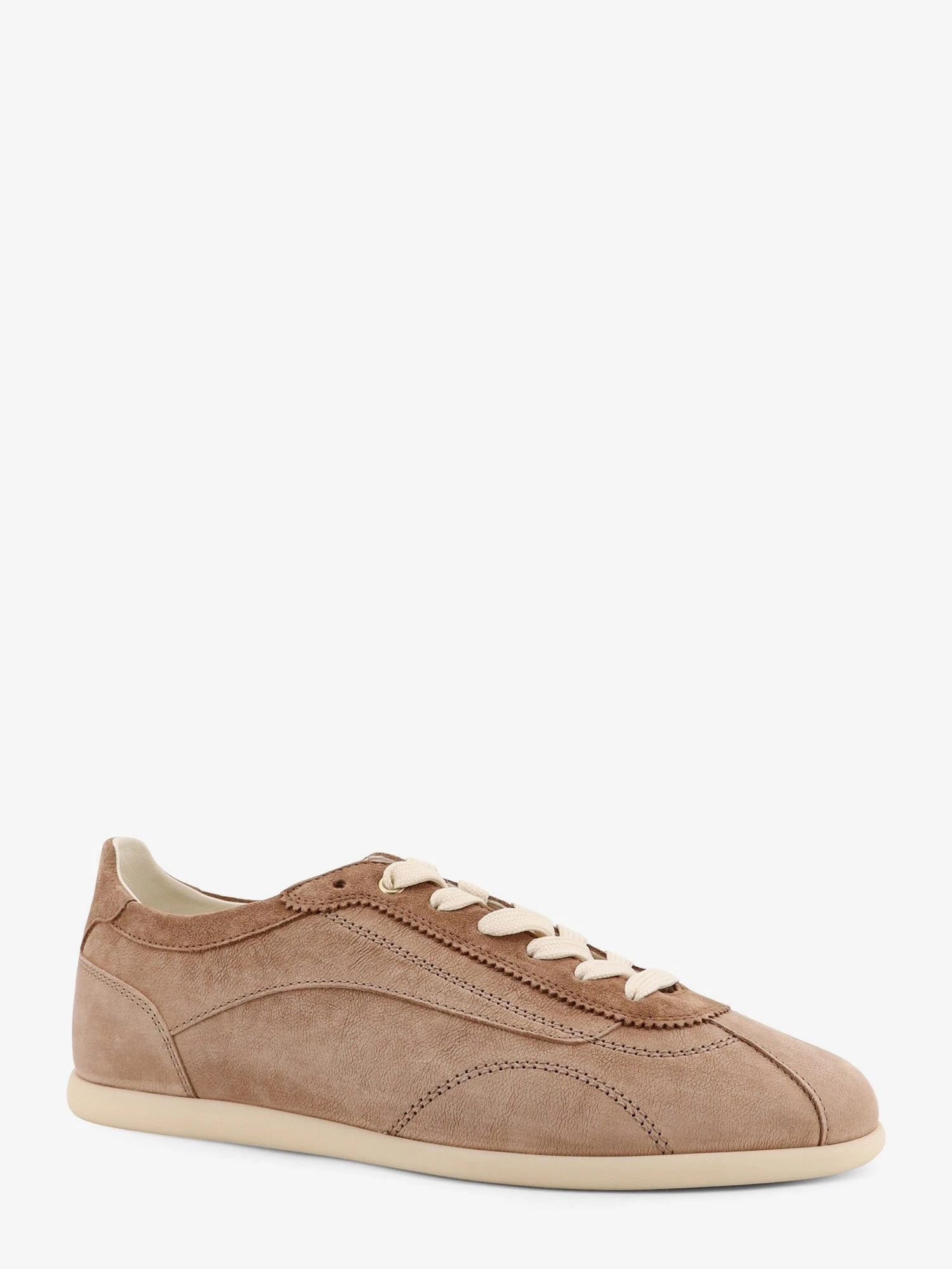 Leather sneakers with stitching detail.webp