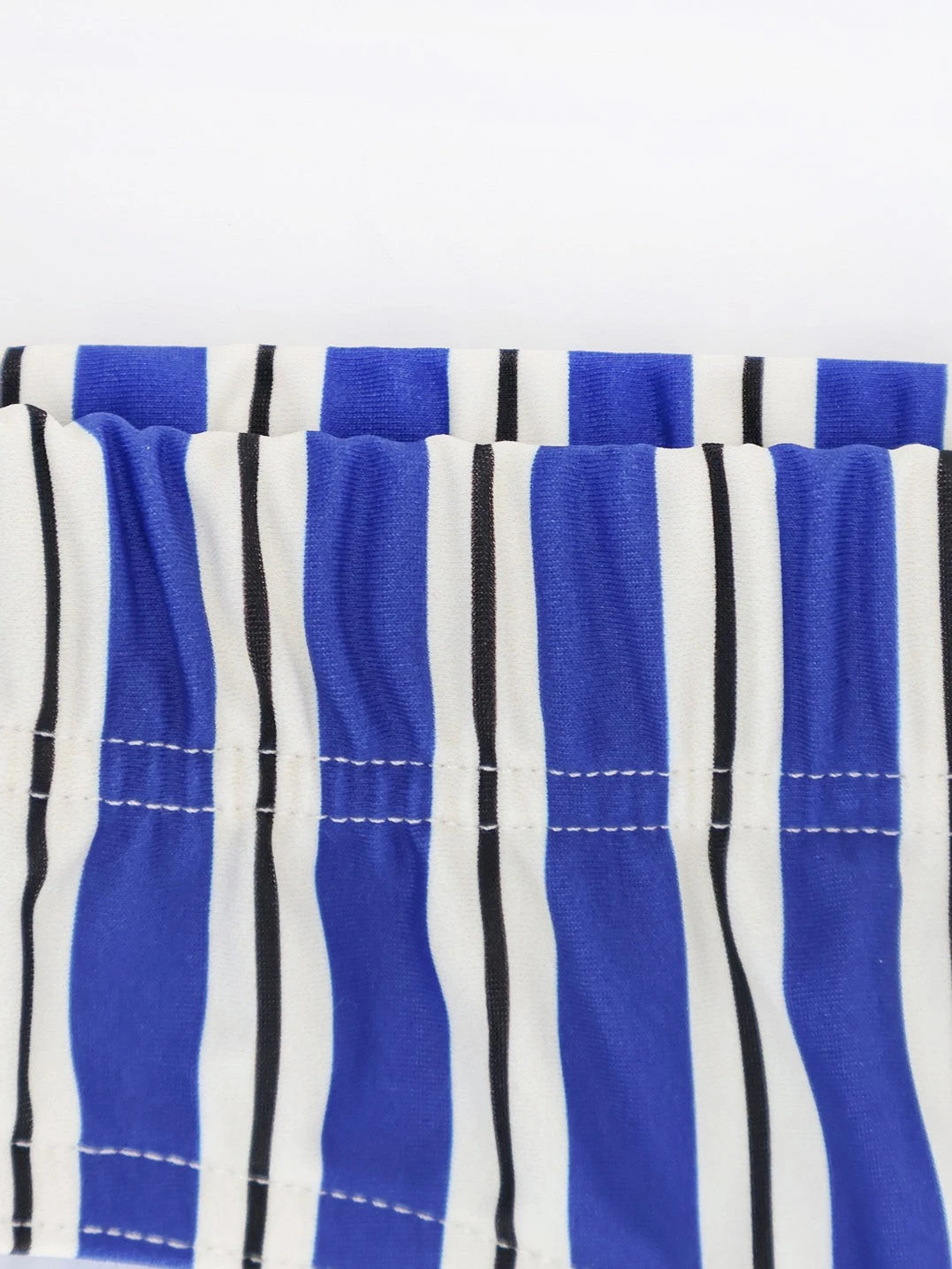 Nylon swim briefs with striped pattern.webp