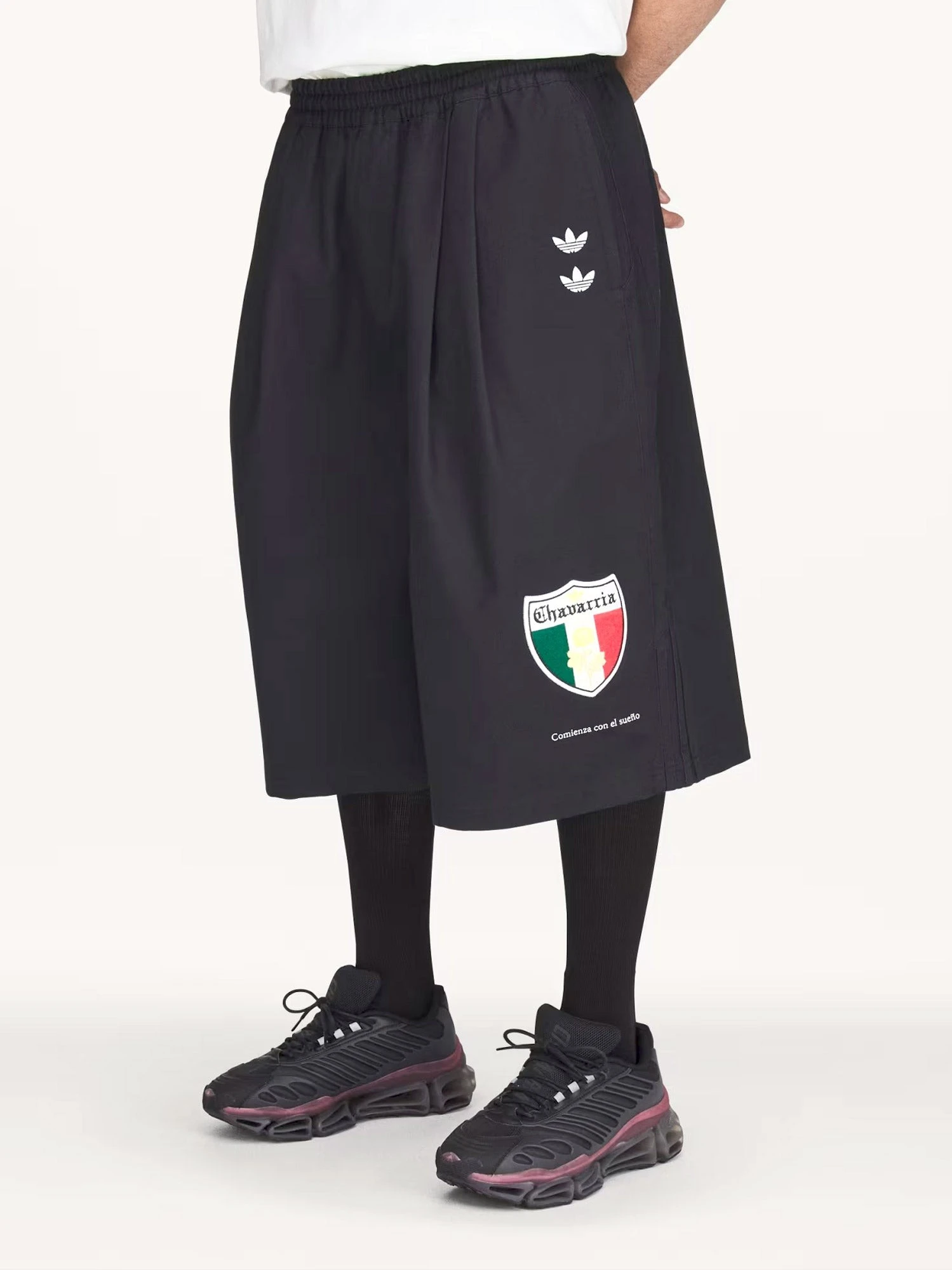 Oversized cotton Bermuda shorts with logo embroidery.webp